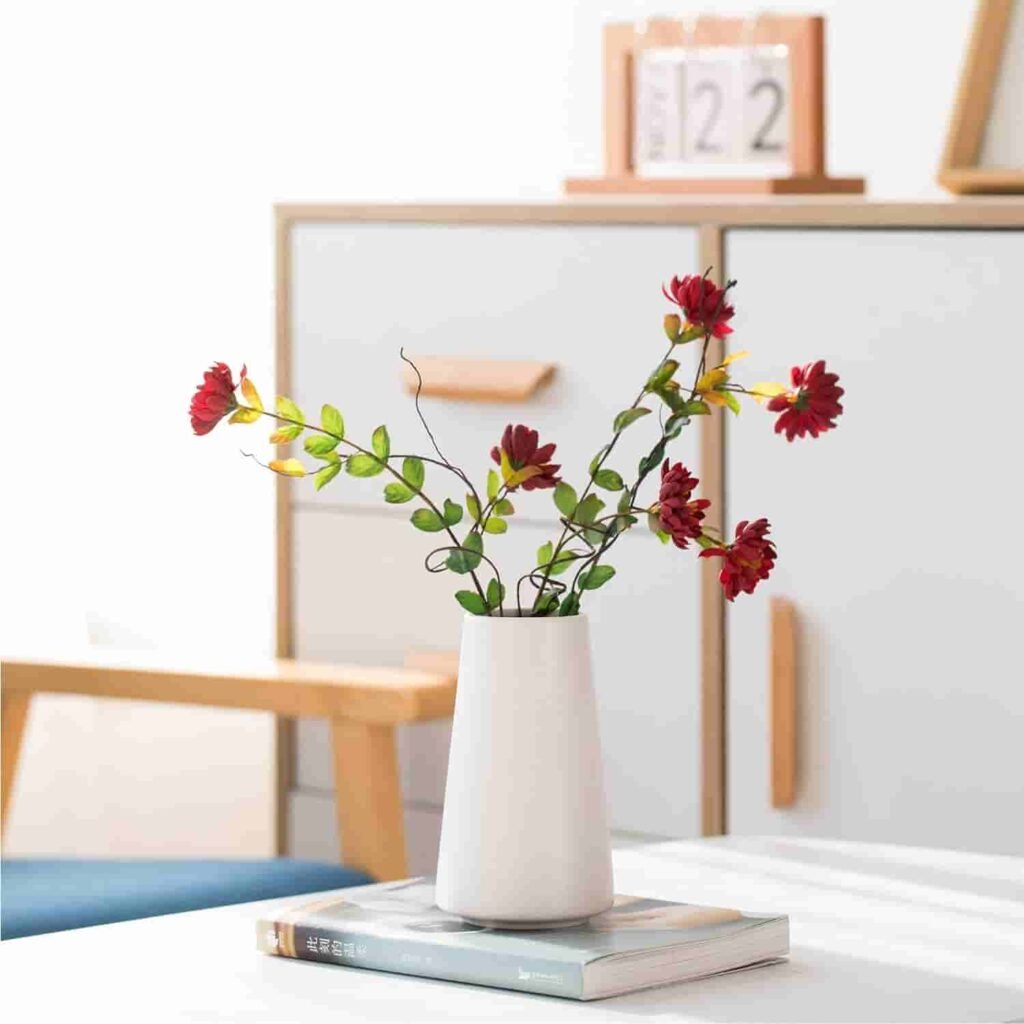 white ceramic vase with flowers